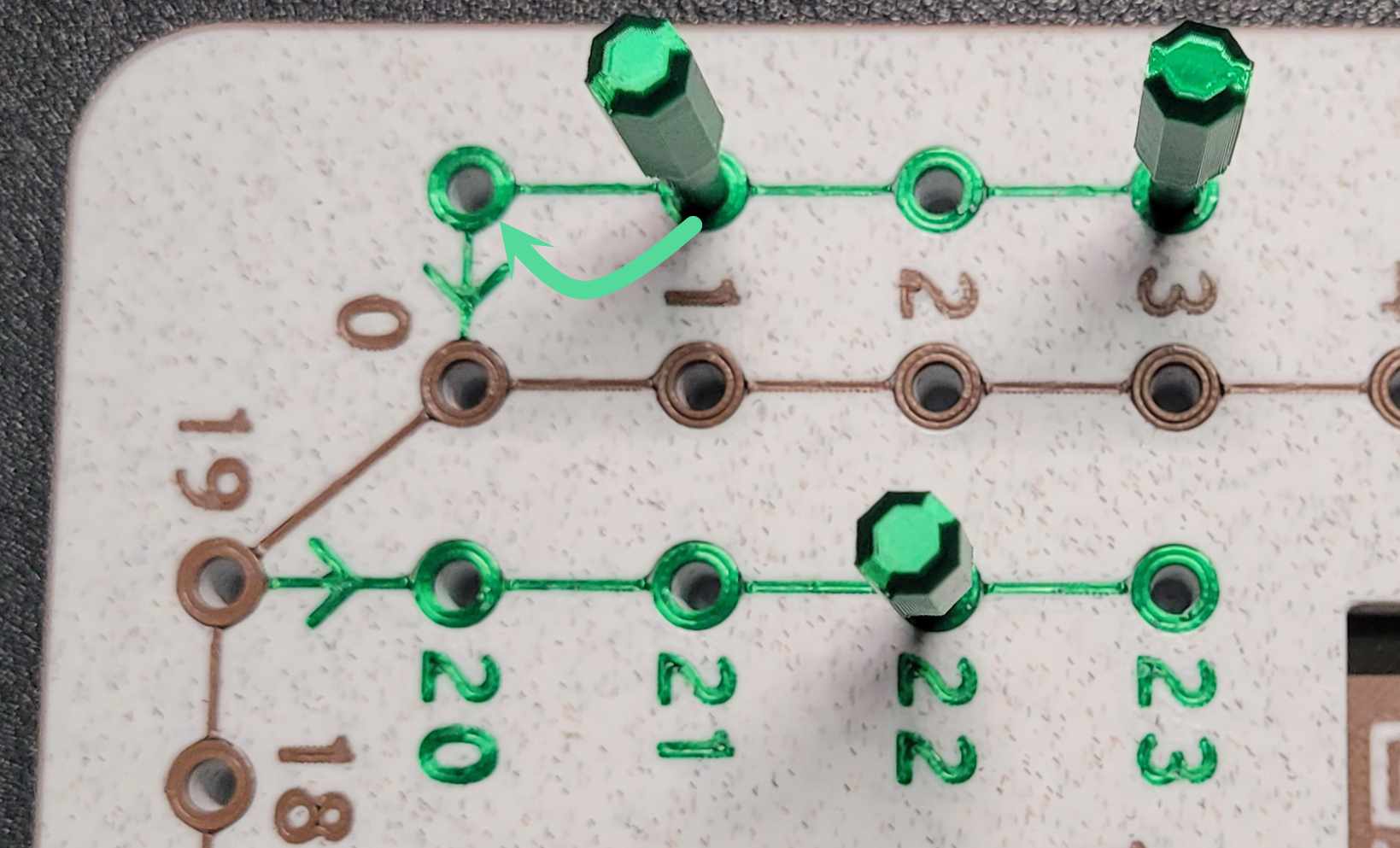 Close-up of a start row with numbered positions and a peg