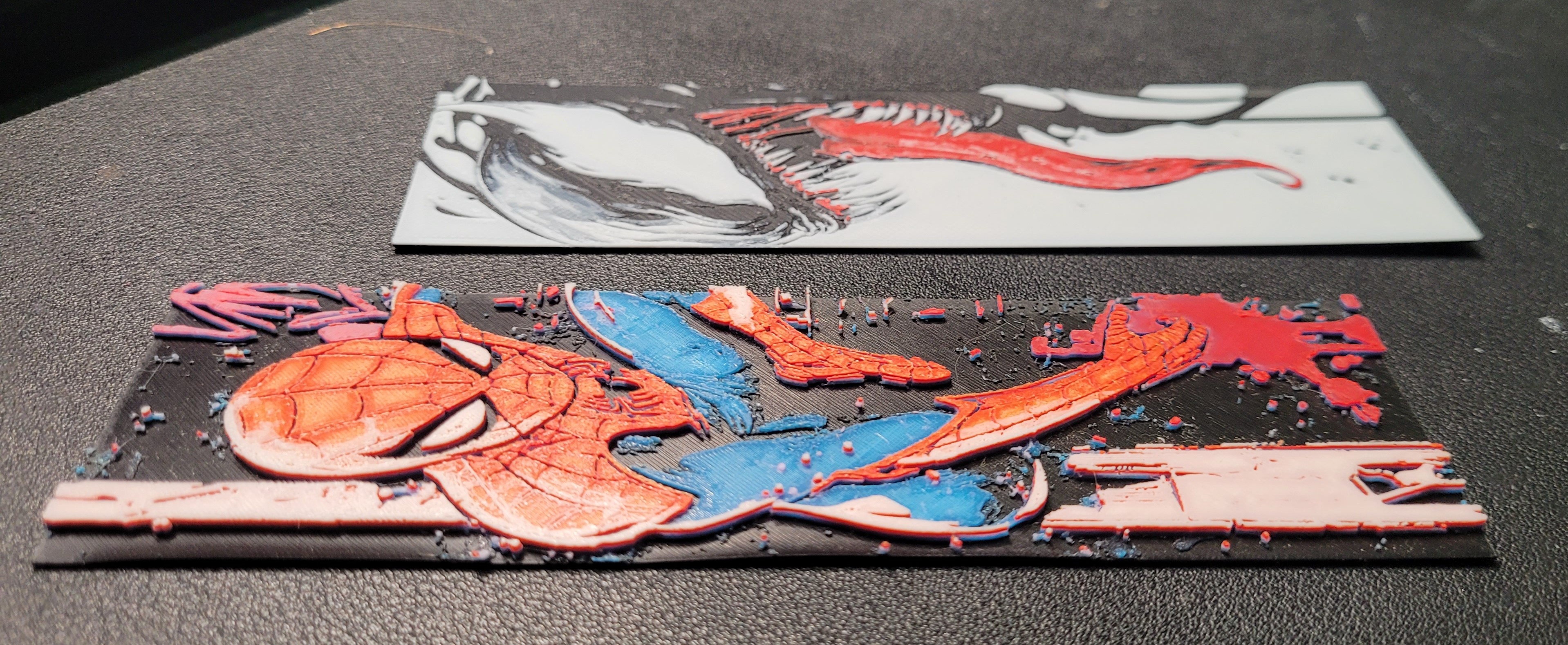 3D printed bookmarks showing raised texture detail